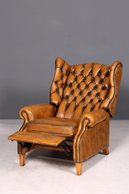 Beautiful original Chesterfield wingback armchair, English genuine leather gentleman’s chair, recliner with reclining function, vintage