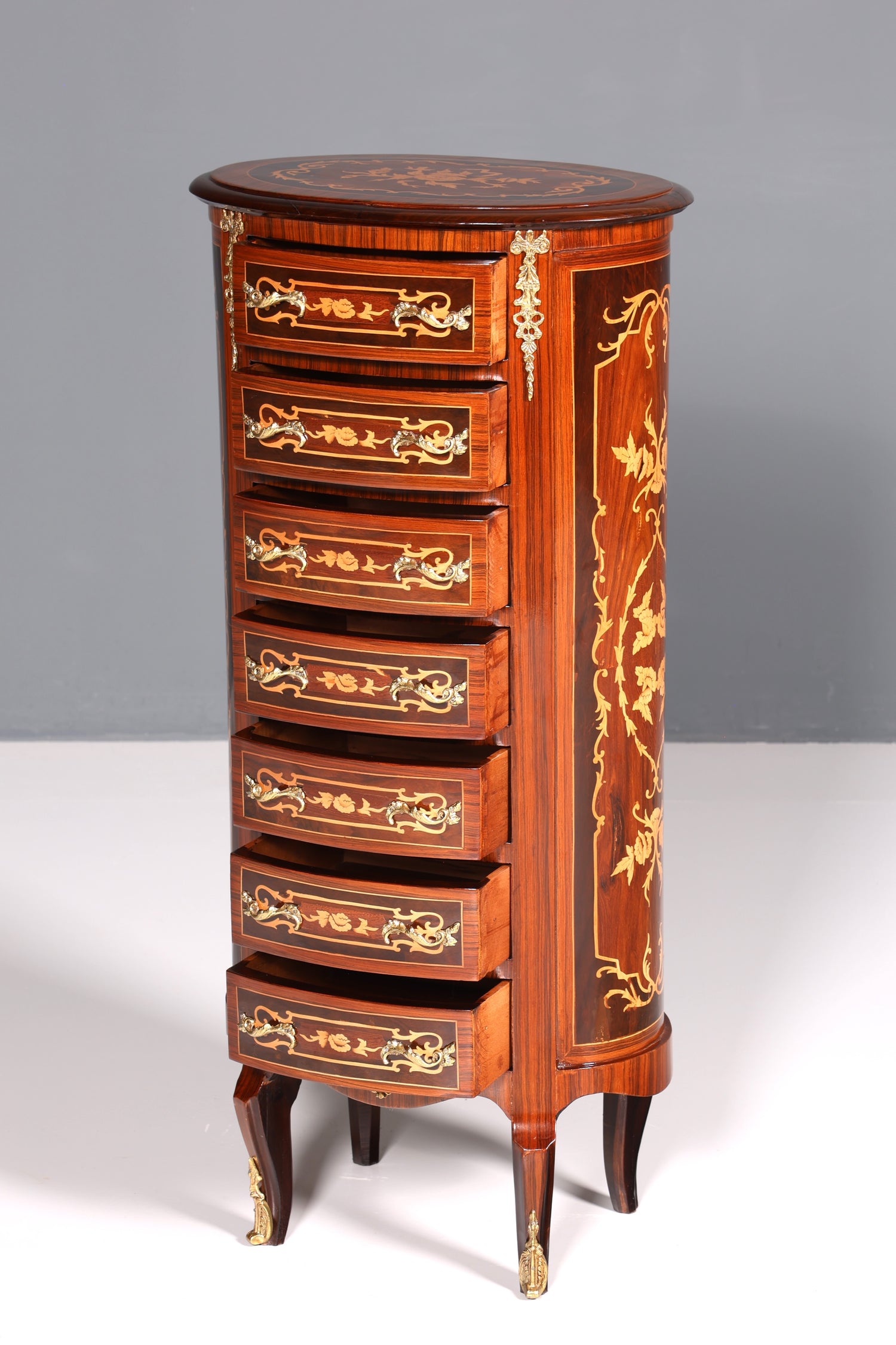 Beautiful oval Baroque style chest of drawers, vertico with inlaid details, 7 drawers