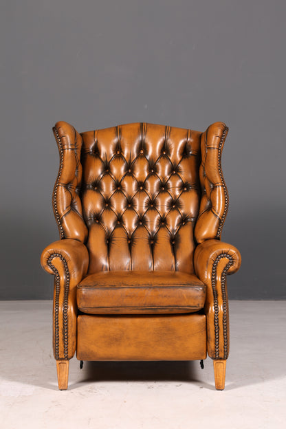 Beautiful original Chesterfield wingback armchair, English genuine leather gentleman’s chair, recliner with reclining function, vintage