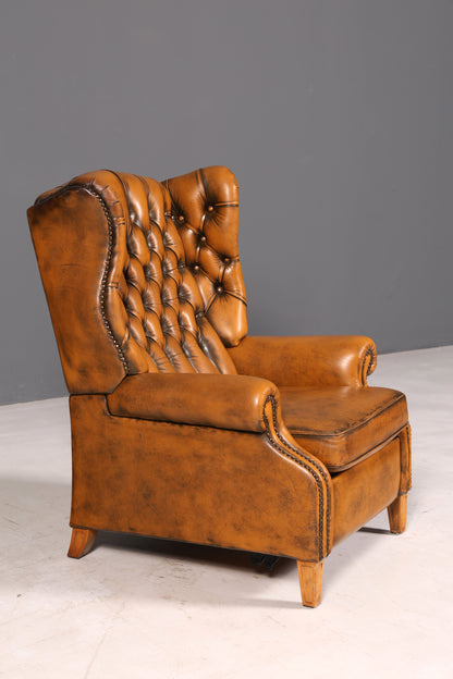 Beautiful original Chesterfield wingback armchair, English genuine leather gentleman’s chair, recliner with reclining function, vintage