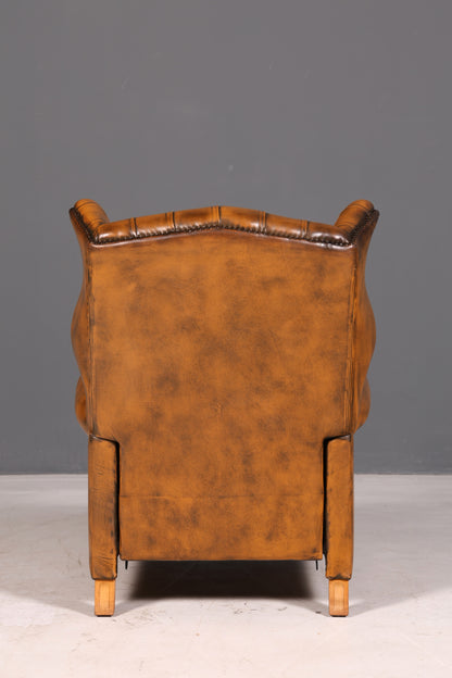 Beautiful original Chesterfield wingback armchair, English genuine leather gentleman’s chair, recliner with reclining function, vintage