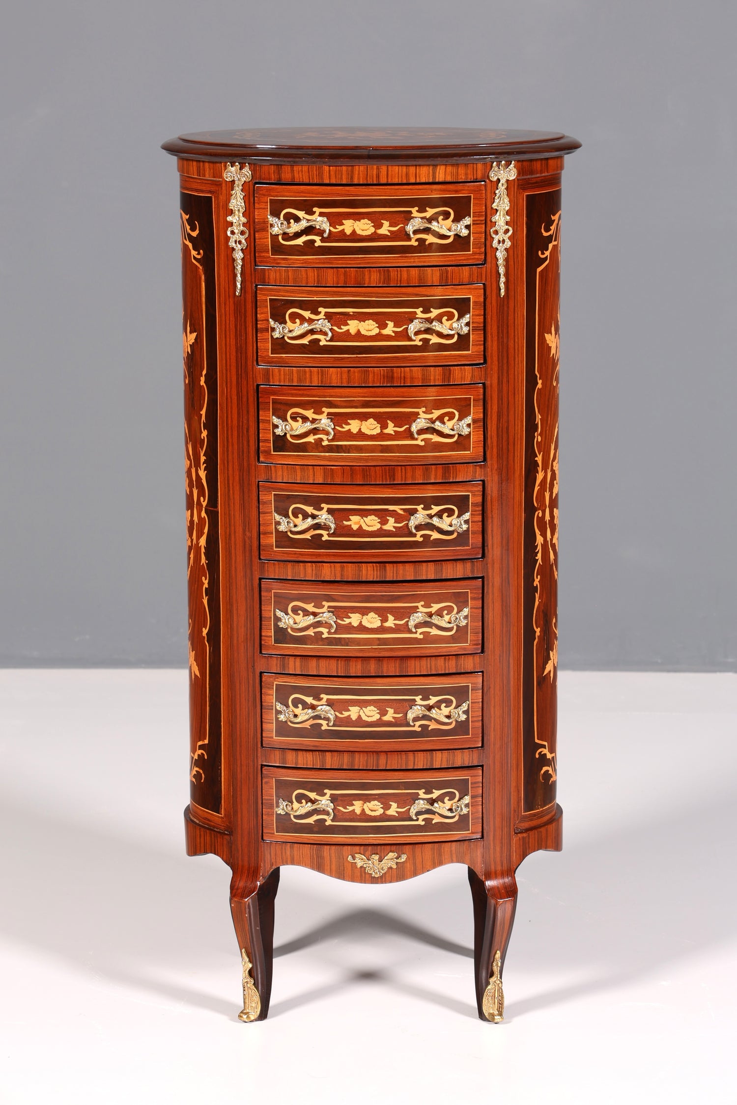 Beautiful oval Baroque style chest of drawers, vertico with inlaid details, 7 drawers