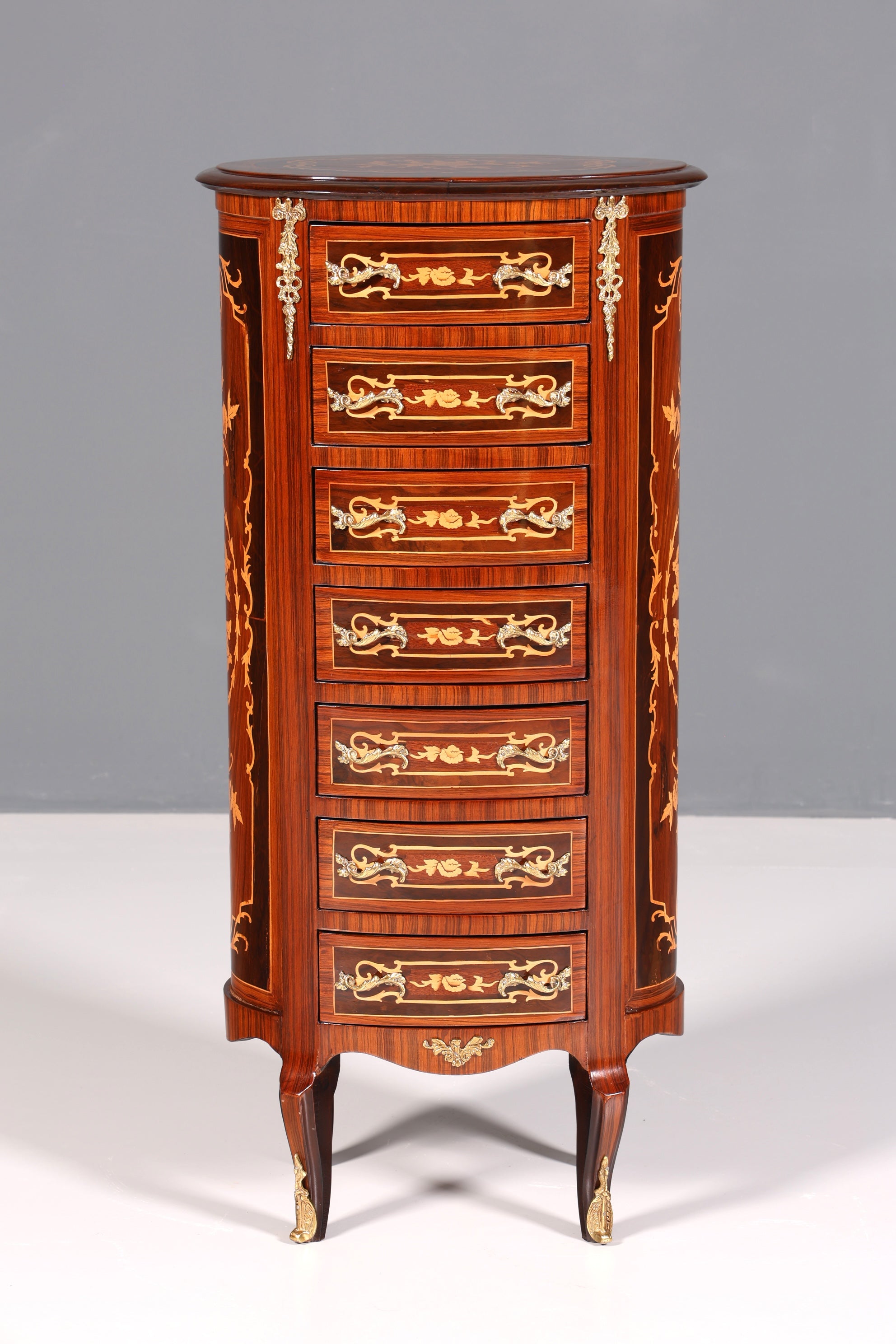 Beautiful oval Baroque style chest of drawers, vertico with inlaid details, 7 drawers