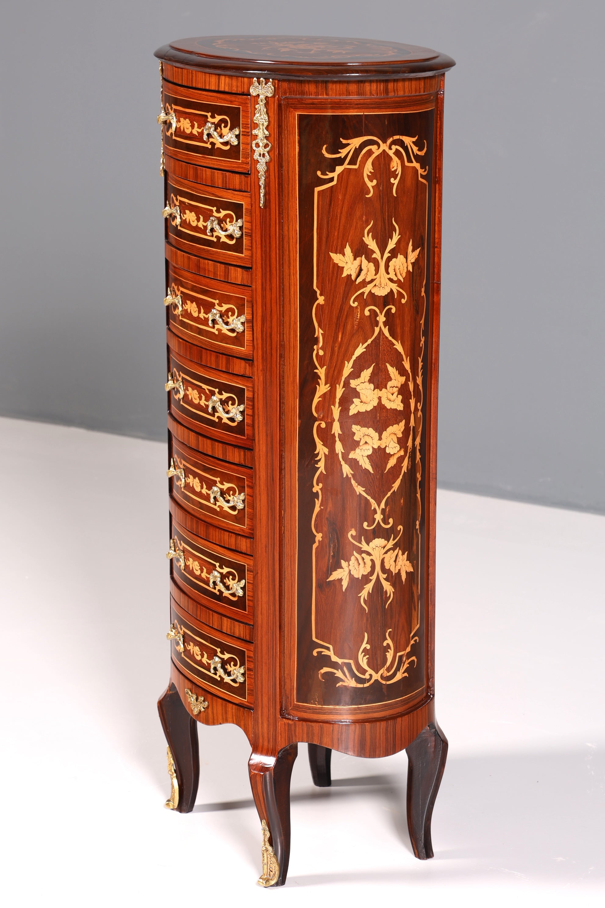 Beautiful oval Baroque style chest of drawers, vertico with inlaid details, 7 drawers