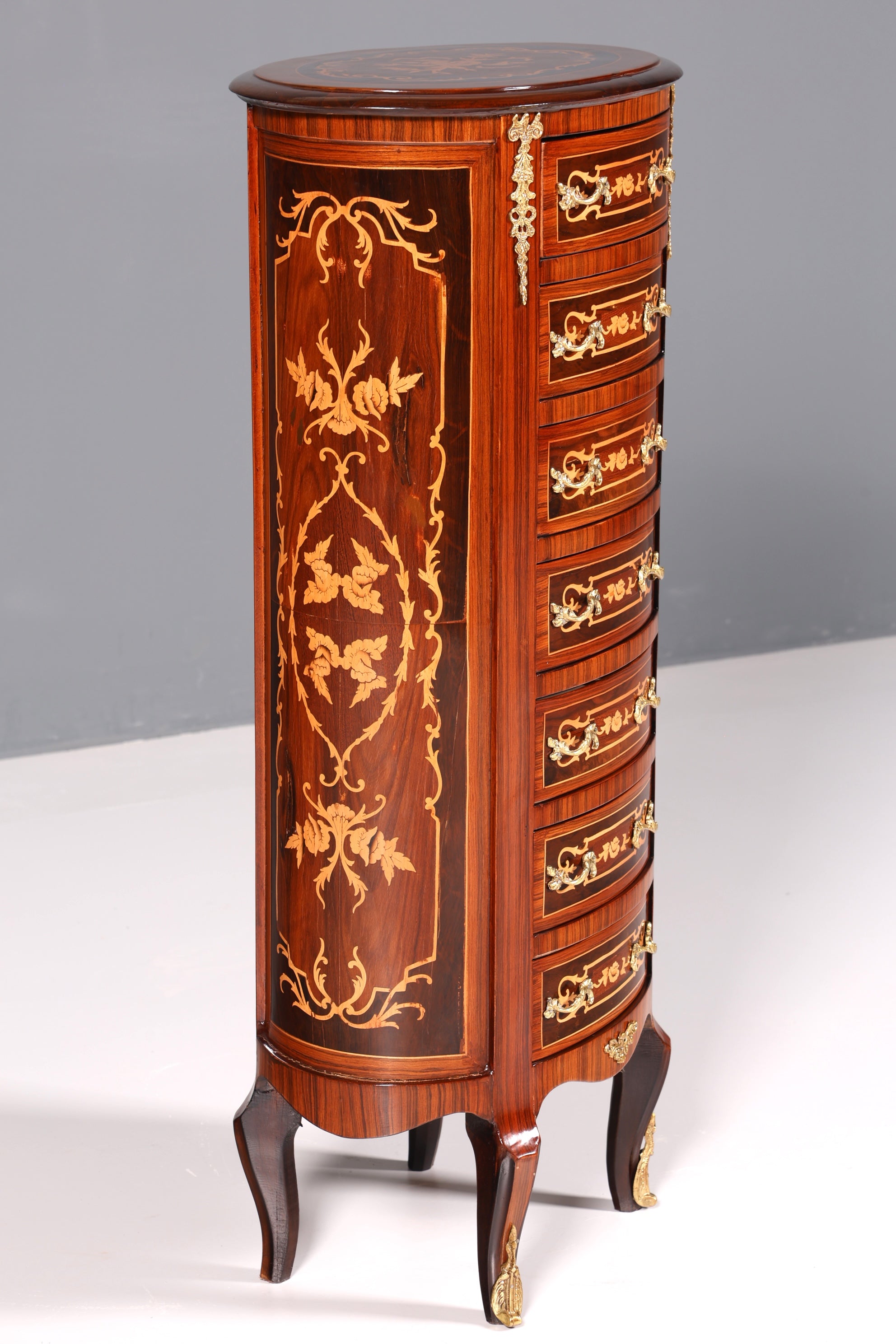 Beautiful oval Baroque style chest of drawers, vertico with inlaid details, 7 drawers